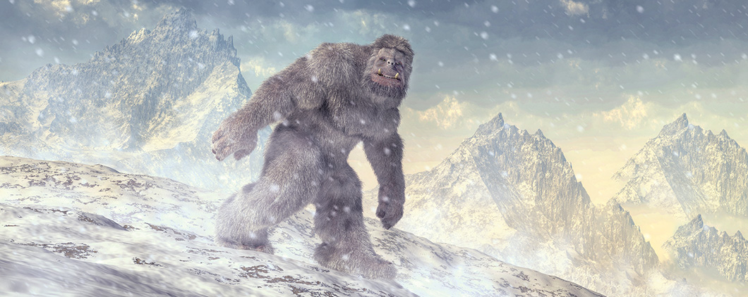 Image of a hairy Yeti traveling through snowy, mountain landscape