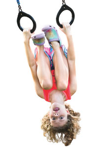 A child hanging upside down
